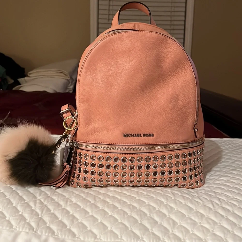 Michael Kors Rhea Medium Silver-Ringed Backpack with Fur Pompom in Coral…